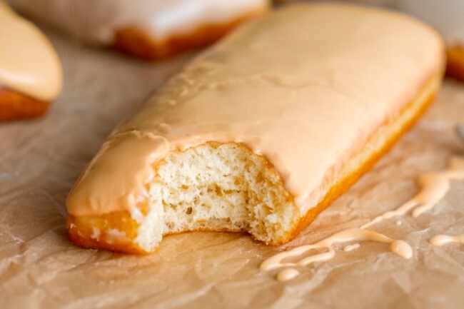 maple donut with maple glaze on parchment paper