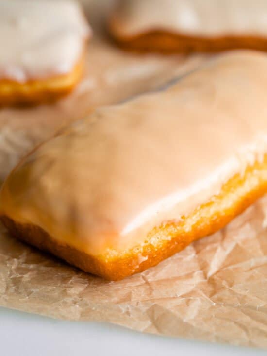 maple bar donut with glaze on parchment paper