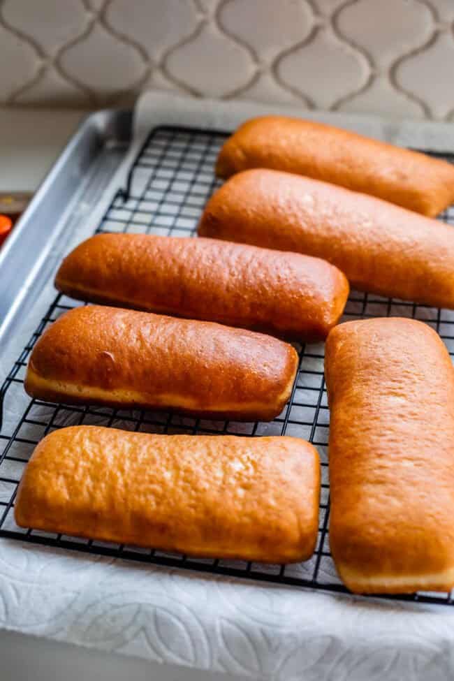 fried donuts on a cooling rack, unfrosted