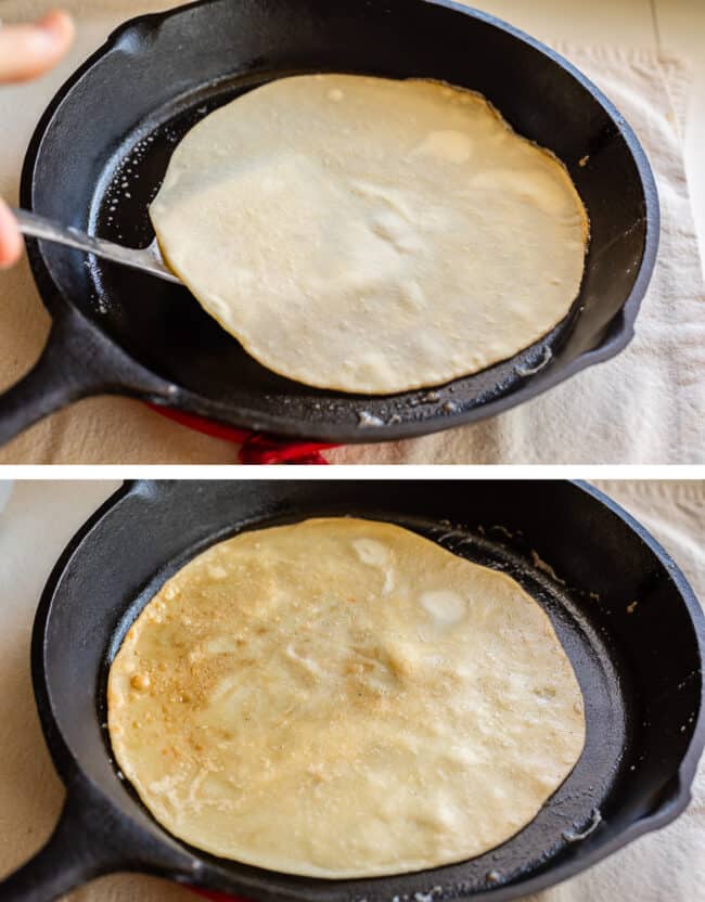 flipping raw roti bread, the bread flipped on the other side in a cast iron skillet