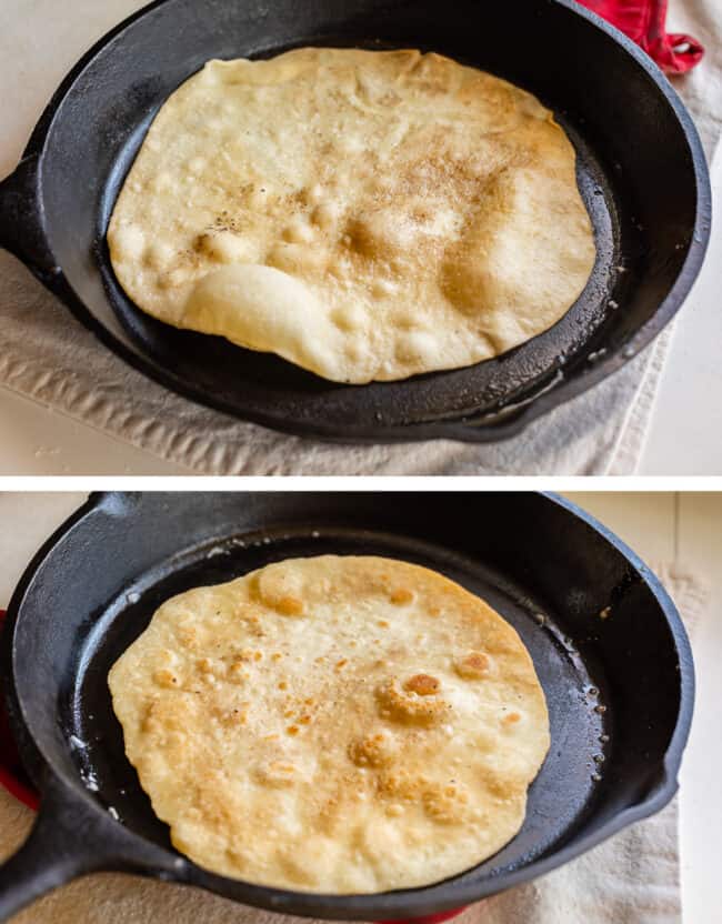 bubbly roti bread cooking in a skillet, flipped with brown spots