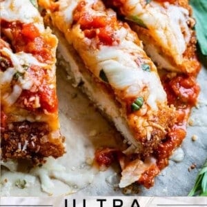 sliced chicken parm with cheese and sauce