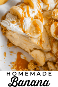slice of banana cream pie drizzled with caramel in a white pie pan.