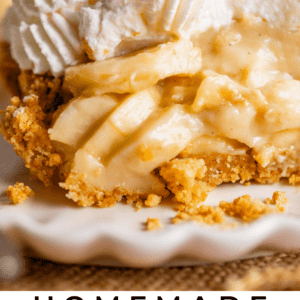 slice of banana cream pie on a plate topped with whipped cream and bananas