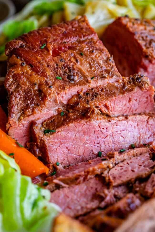 slow cooker corned beef sliced, with carrots and cabbage.