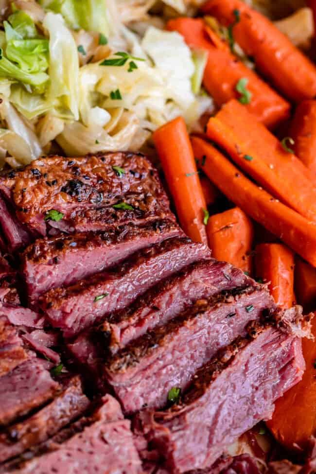sliced corn beef and cabbage with carrots.