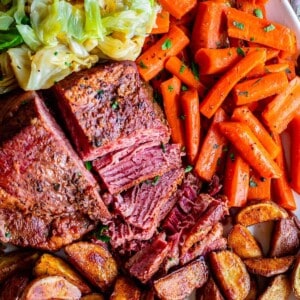 corned beef recipe with carrots, cabbage, potatoes on a platter