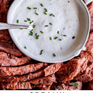 bowl of horseradish sauce surrounded by corned beef