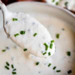 horseradish sauce on a spoon with chives