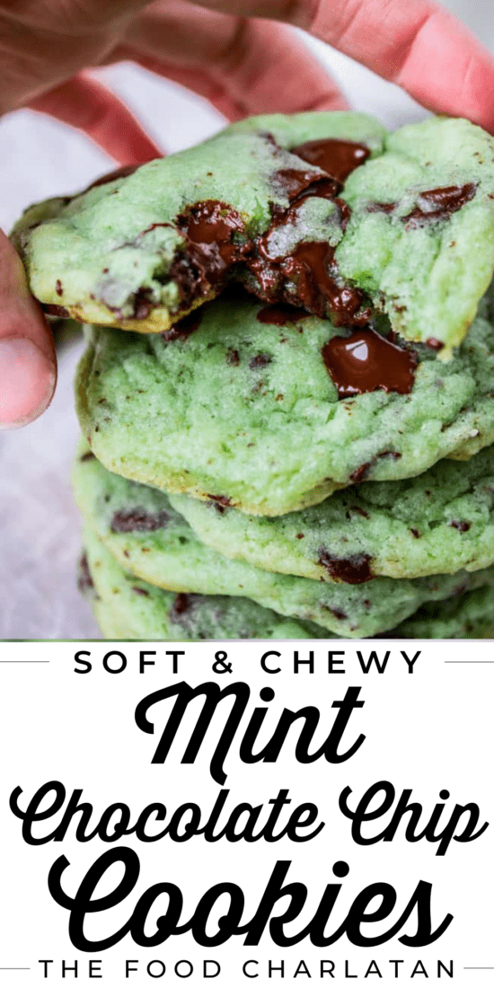 stack of green mint cookies with hand picking up the top one
