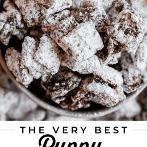 puppy chow stuck together in large chunks in a white bowl shot from overhead