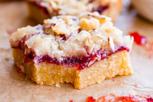 raspberry bar with streusel with a bite taken out.