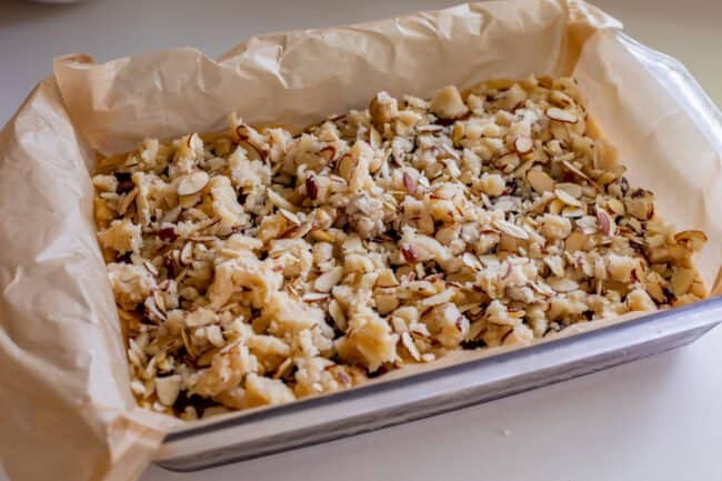 raspberry crumb bars in a pan before baking.