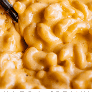 close up of creamy mac and cheese with spoon.