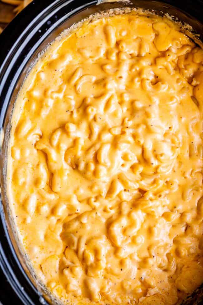 slow cooker mac and cheese shot from overhead in a black crockpot.