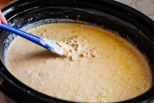 slow cooker macaroni and cheese after one hour of cooking in the pot.