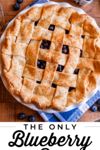 whole blueberry pie with a lattice crust shot from overhead.