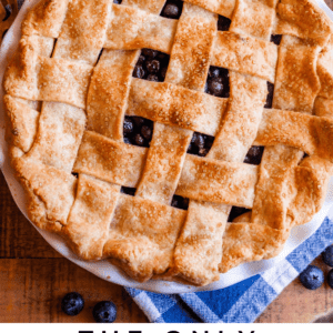 whole blueberry pie with a lattice crust shot from overhead.