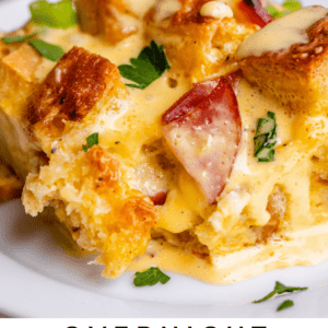 Angled shot of eggs benedict breakfast casserole on white plate.