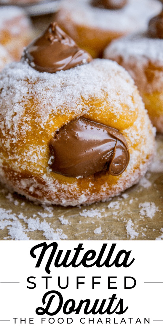 Nutella stuffed donut coated with sugar and topped with nutella.