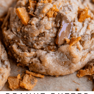 butterfinger bits cookie recipe with melty chocolate and broken up butterfinger on the side.