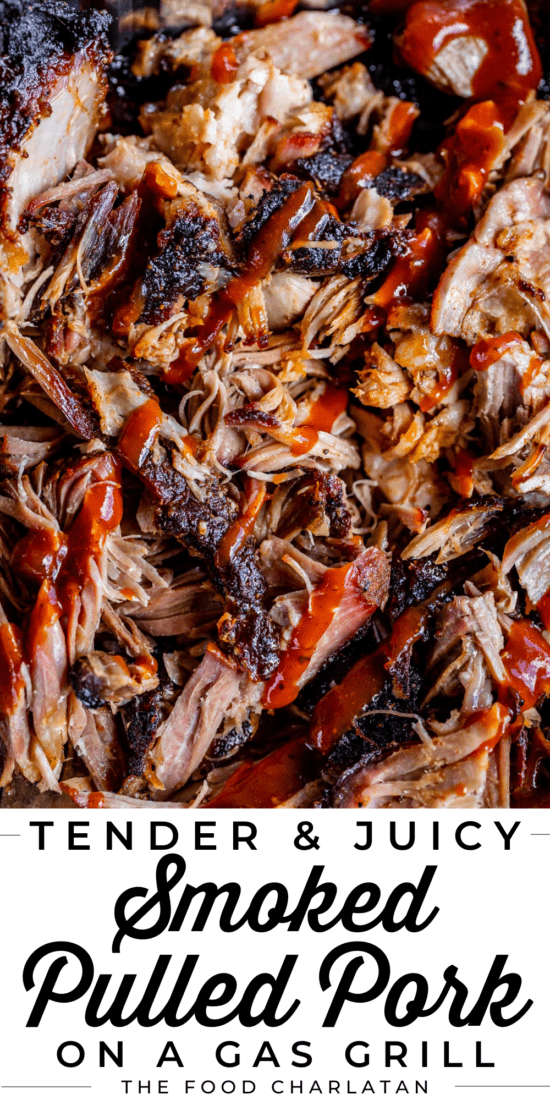 smoked pulled pork with blackened bark edges drizzled with bbq sauce.