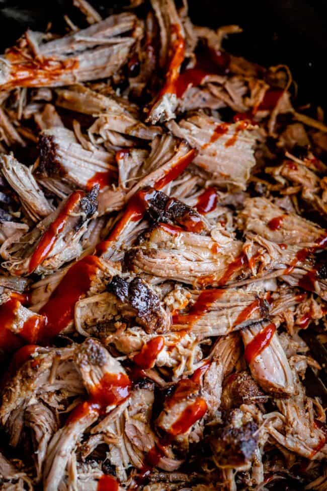 slow cooker pulled pork shredded and topped with bbq sauce.