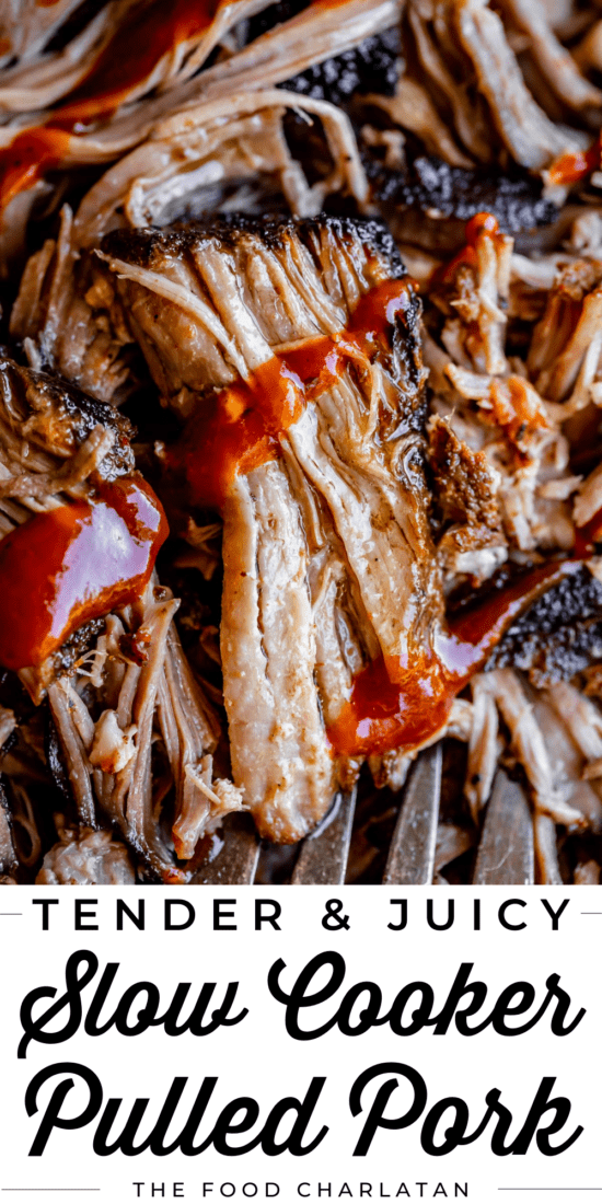 close up of shredded pulled pork with blackened edges and bbq sauce.