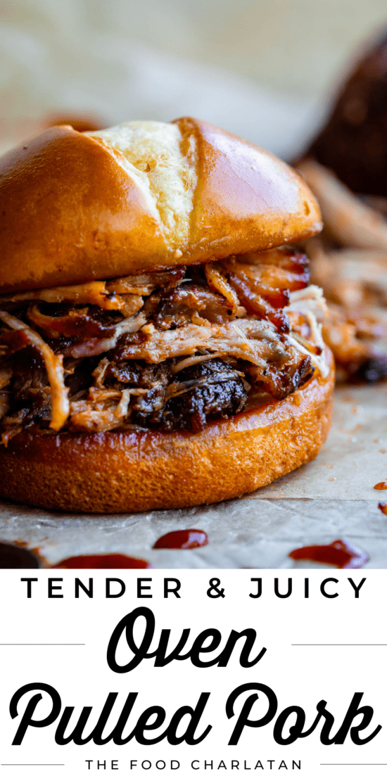 pulled pork sandwich on a hamburger bun with bbq sauce on parchment paper.