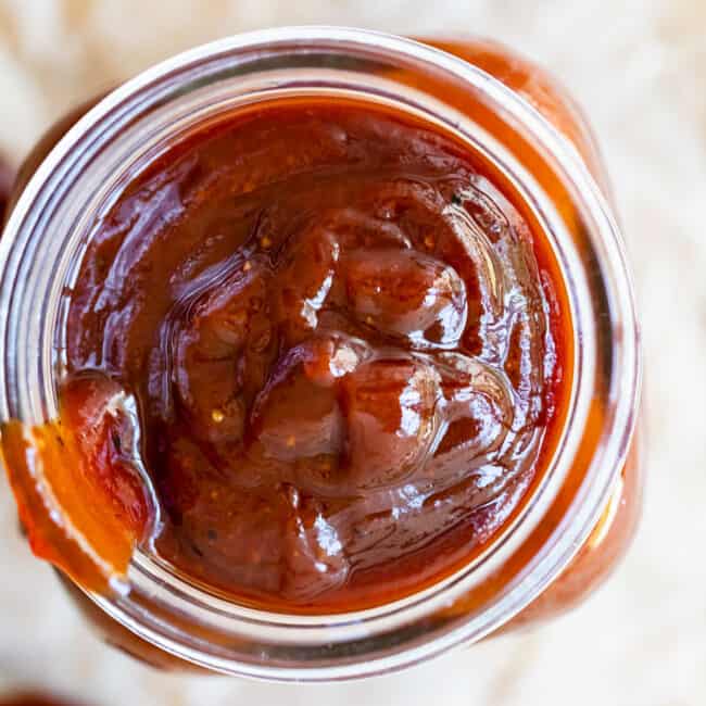 overhead shot of homemade bbq sauce in a jar.