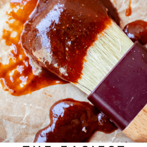brush with bbq sauce on it laying on parchment paper.