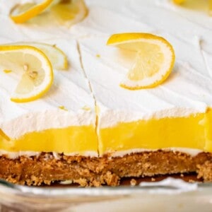 Side view of slices of lemon lush dessert in dish.