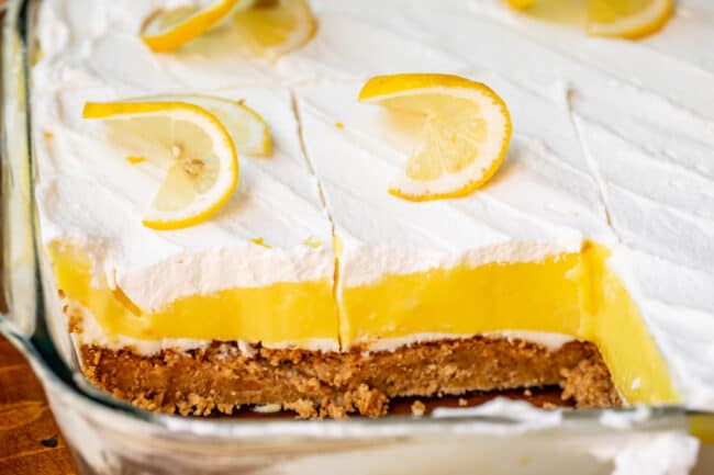 Side view of slices of lemon lush dessert in dish.