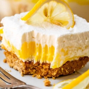 Lemon lasagna dessert with bite taken out.