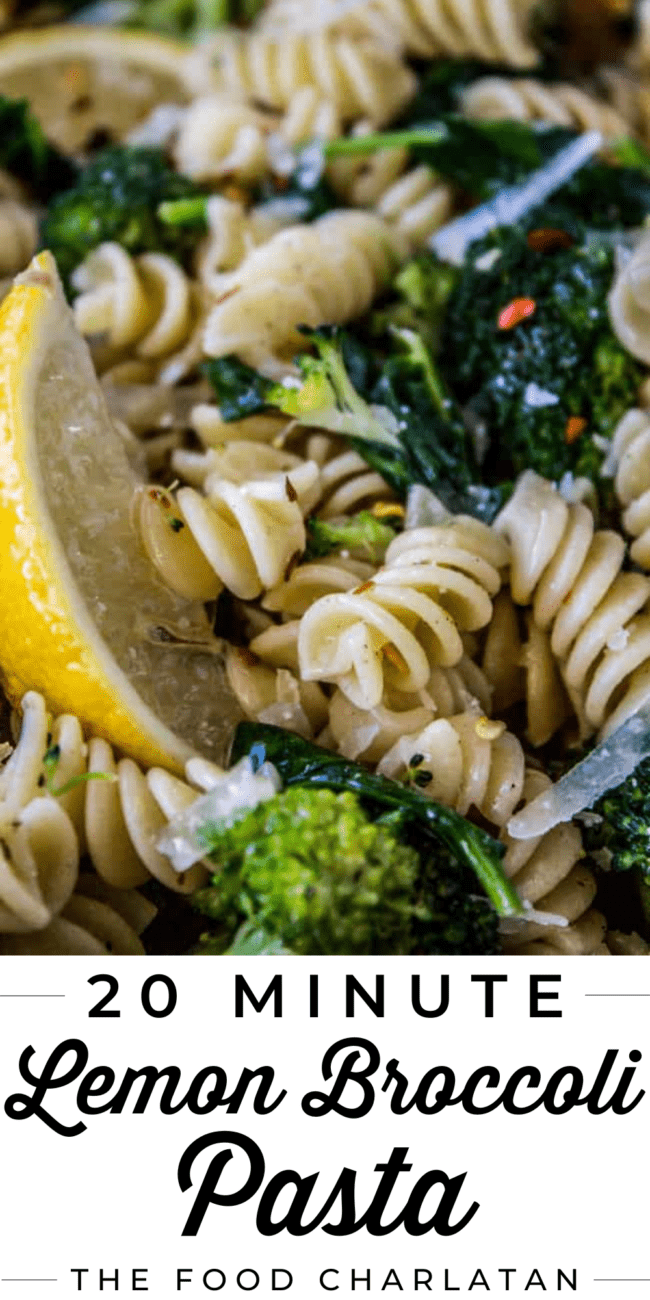 pasta and broccoli close up, with a wedge of lemon on the side.