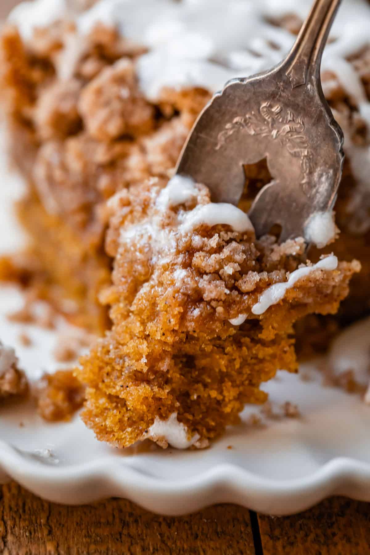 a bite of pumpkin streusel coffee cake on a fork.