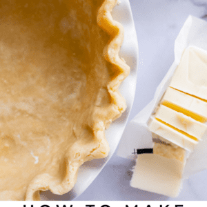 Close-up of an unbaked pie crust in a dish, with a stack of butter slices and a measuring cup filled with flour nearby. Text reads “Pie Crust Recipe – The Food Charlatan.”.