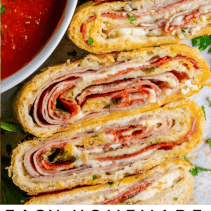 sliced Stromboli sandwich with marinara dipping sauce.