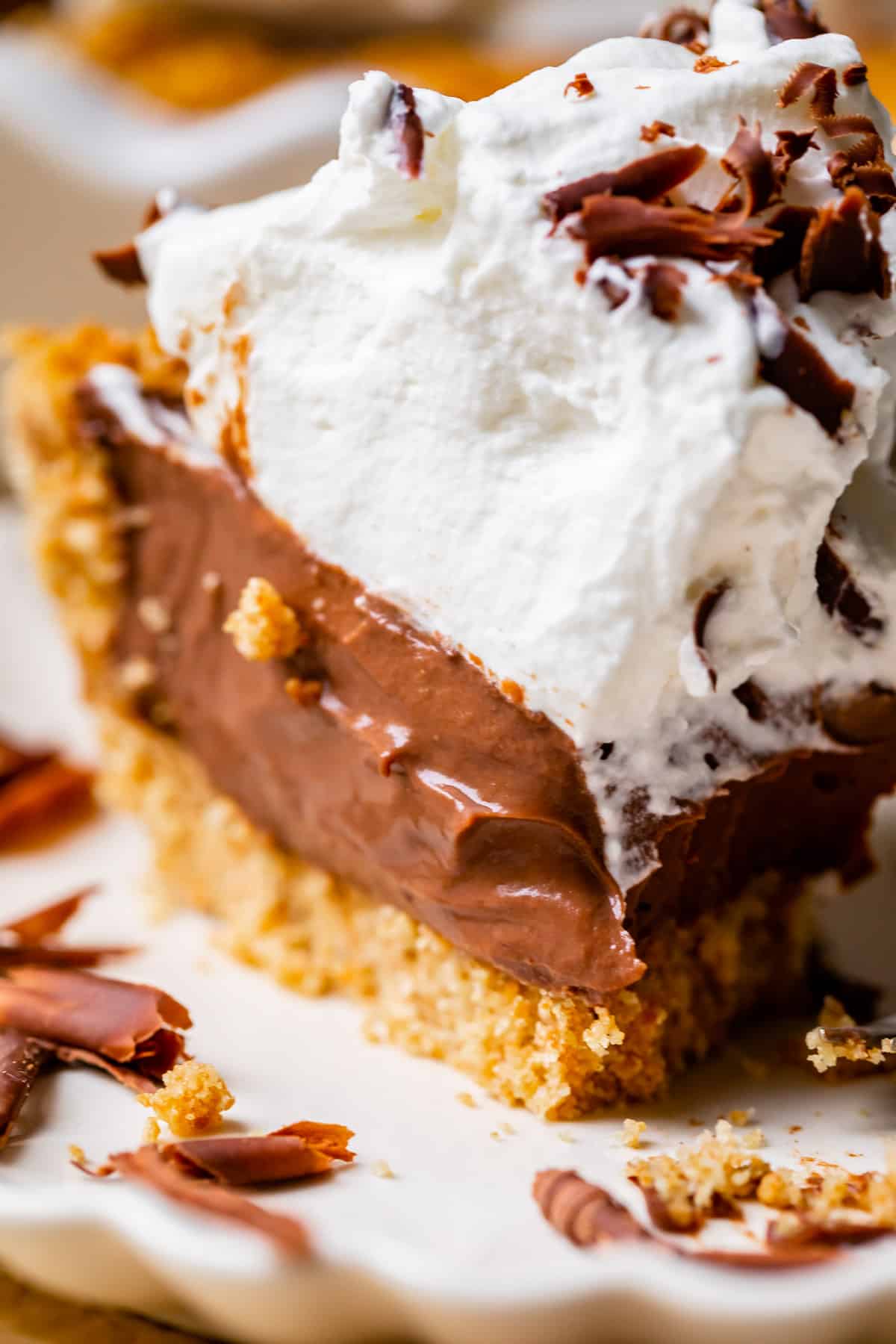 chocolate cream pie with graham cracker crust and whipped cream.