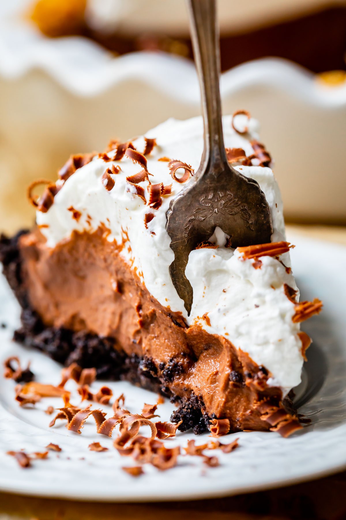 chocolate pie cream on a plate with a fork taking a bite.