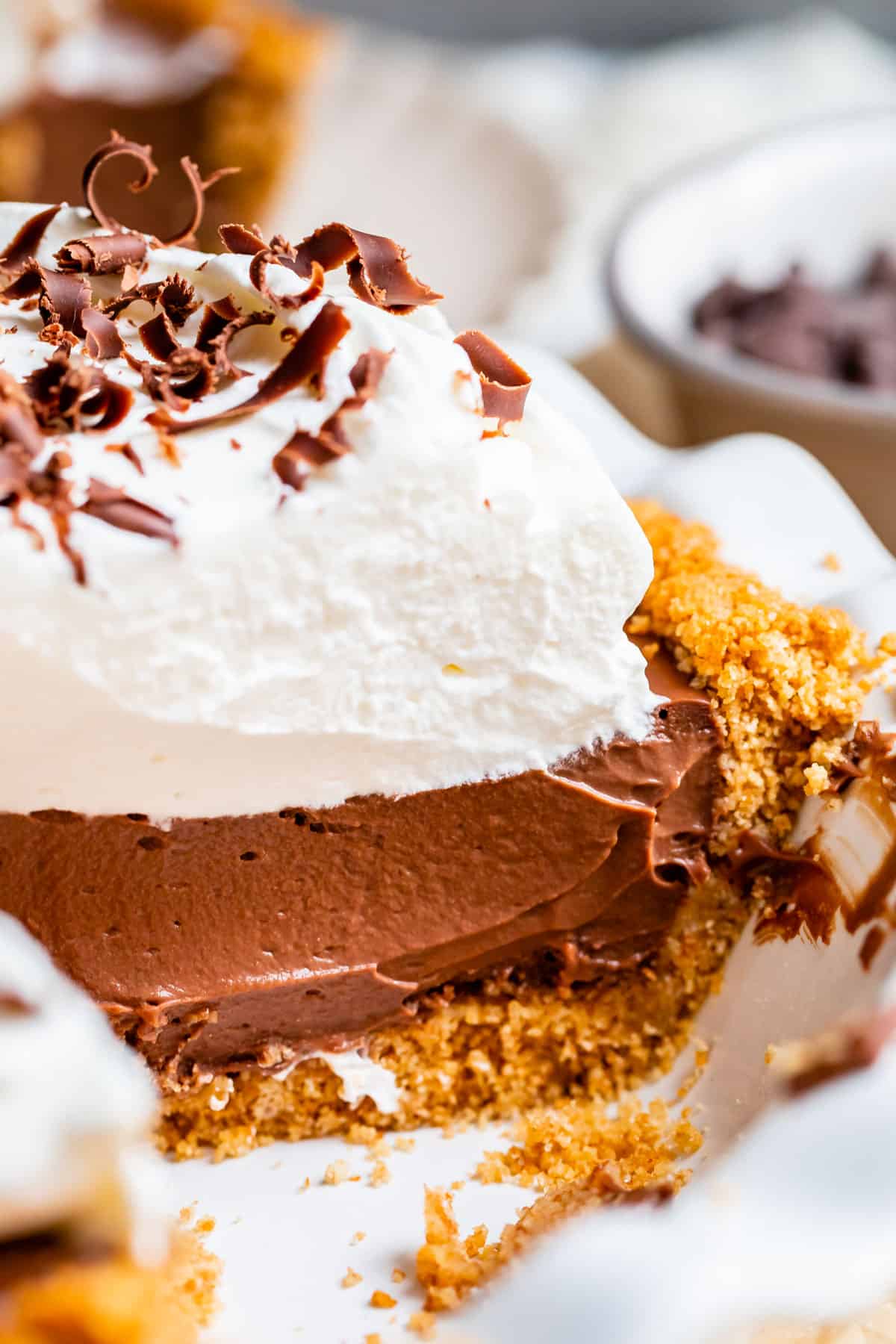 best chocolate cream pie with graham cracker crust and chocolate curls.