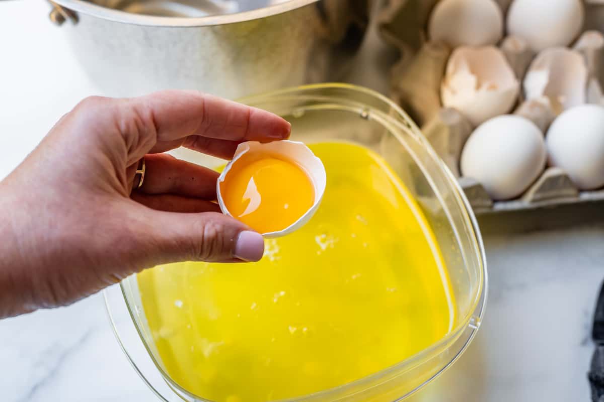 separating an egg, yolk in shell.