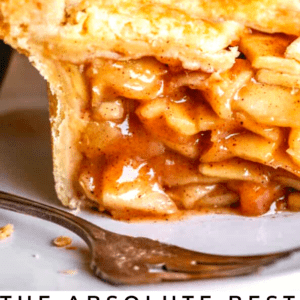 A close-up of a sliced homemade apple pie, showcasing the flaky golden crust and cinnamon-spiced apple filling. Text reads: The Food Charlatan. Perfect for cozy gatherings and classic dessert lovers.