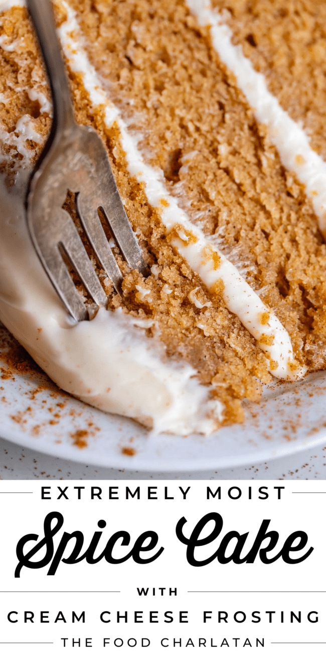 homemade spice cake with cream cheese frosting and a fork.