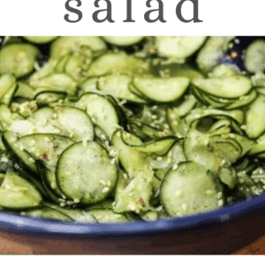 A bowl of sliced Asian cucumber salad with herbs and seasonings. The text reads cucumber salad, get the recipe, and www.thefoodcharlatan.com.