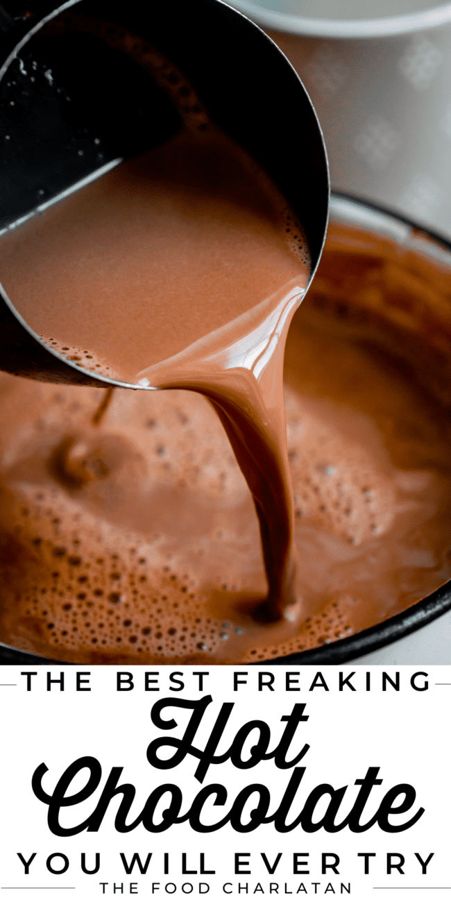 crock pot hot chocolate being poured into a pot from a measuring cup.