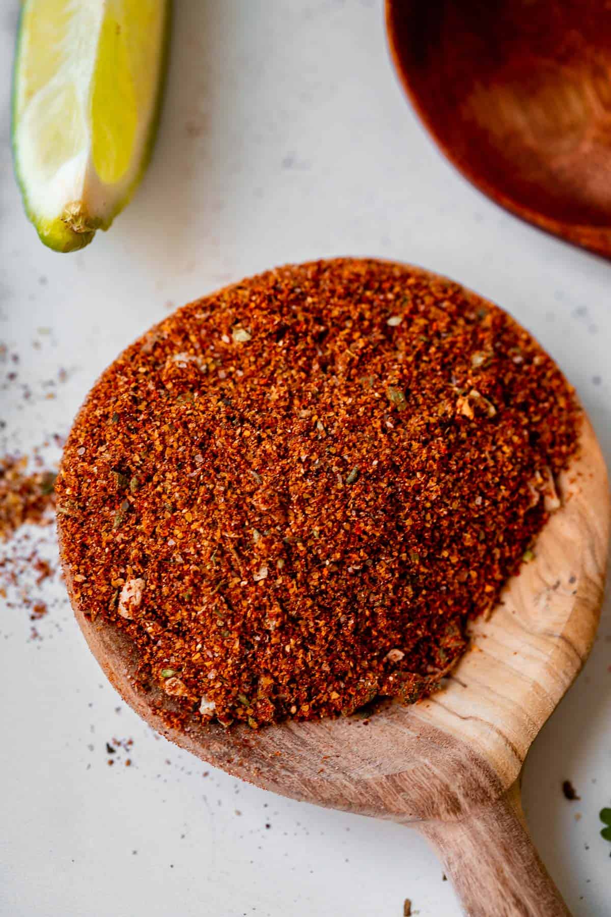diy taco seasoning on a wooden spoon on a counter