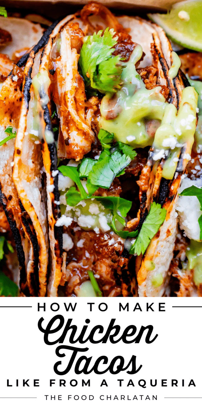 crock pot shredded chicken taco with double tortillas, green sauce, cilantro, and white cheese.