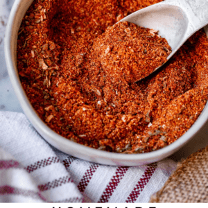 taco seasoning recipe in a white bowl with a metal spoon.