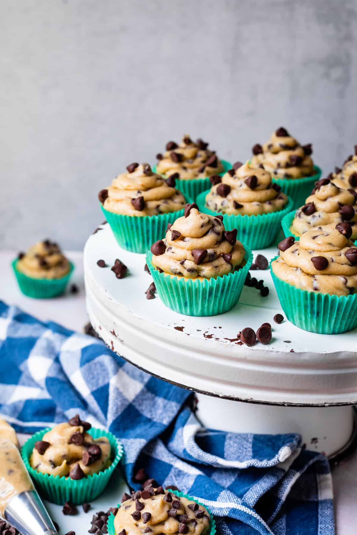 cookie dough frosting on cupcakes, arranged on a  cake stand.